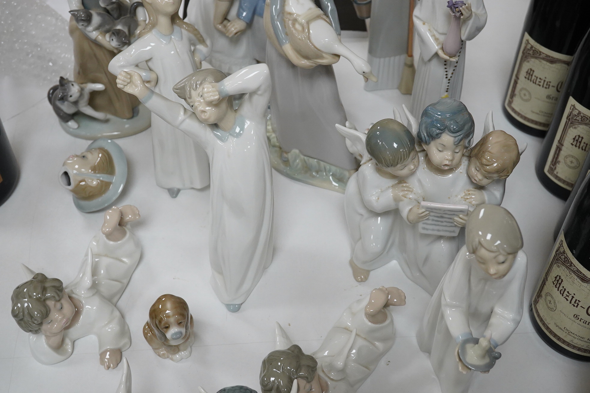 Fifteen Lladro figures or groups, 28cm high. Condition - one child group figure head broken.